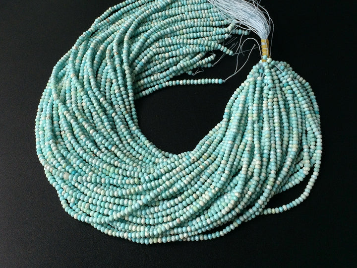 15.5" 2x4mm light Blue howlite roundel/rondelle faceted beads