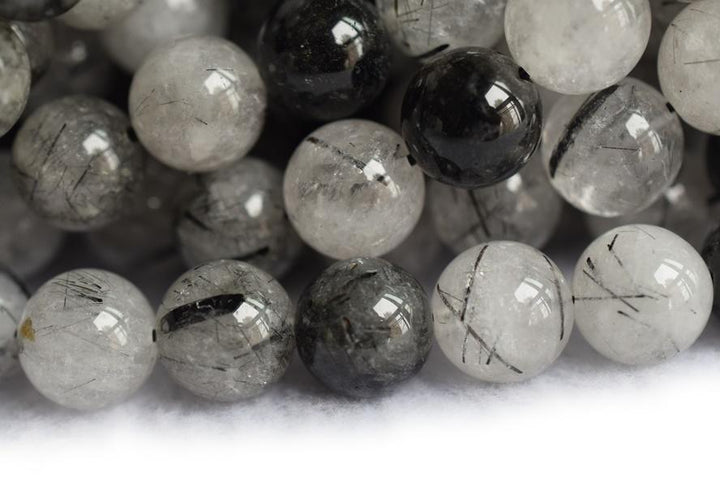 Rutilated Quartz - Round faceted- beads supplier