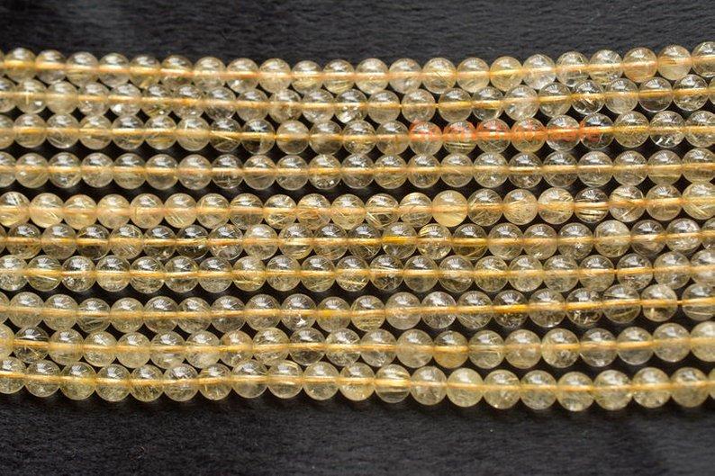 Rutilated Quartz - round- beads supplier
