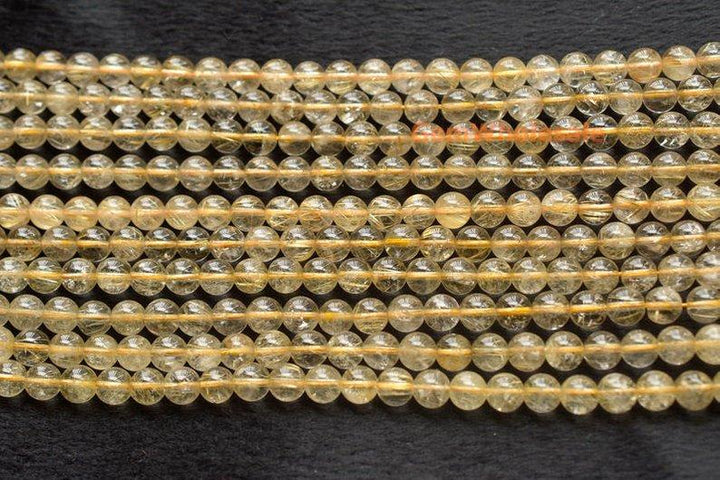 Rutilated Quartz - round- beads supplier