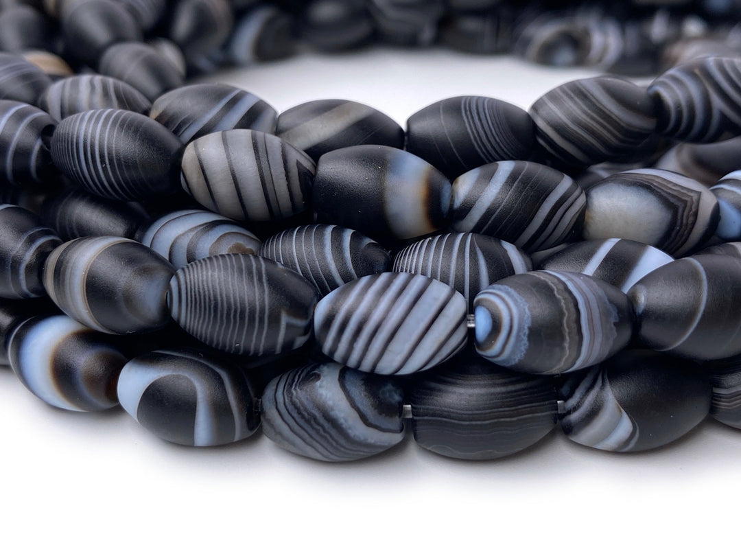 15.5" 8x12mm matte/frosted black stripe Agate oval/rice beads