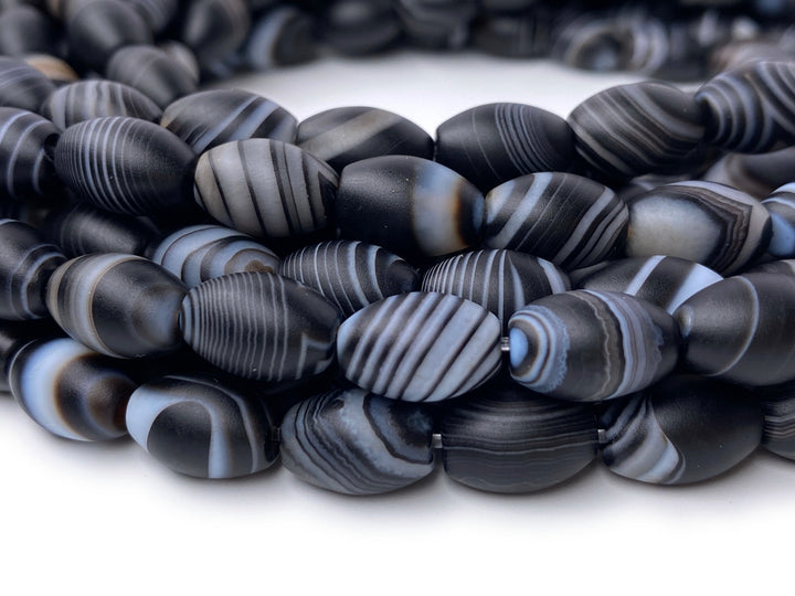 15.5" 8x12mm matte/frosted black stripe Agate oval/rice beads