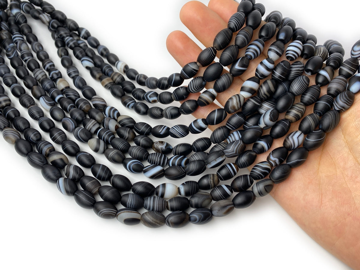 15.5" 8x12mm matte/frosted black stripe Agate oval/rice beads